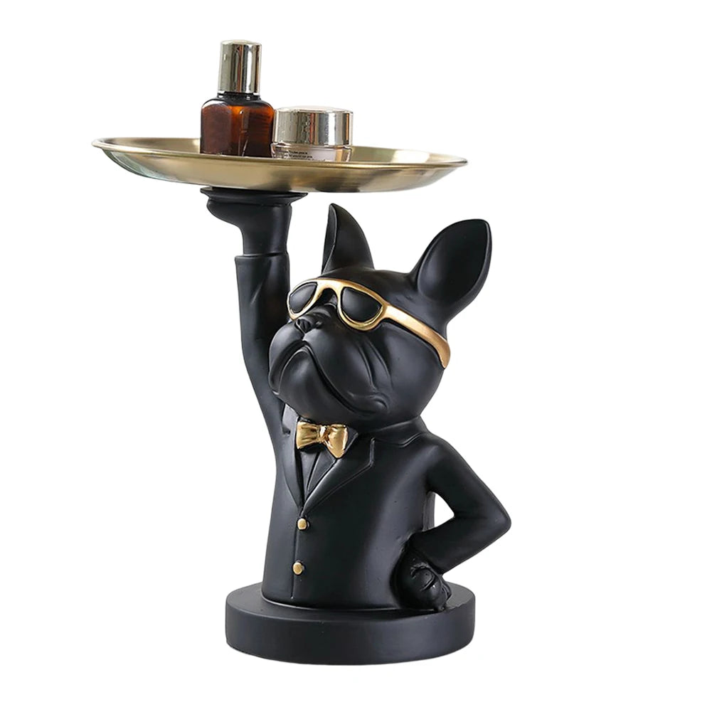 Sculpture de chien majordome noir au look chic avec lunettes dorées, nœud papillon et plateau levé — un objet déco stylé et pratique qui impose sa prestance dans tout intérieur moderne
