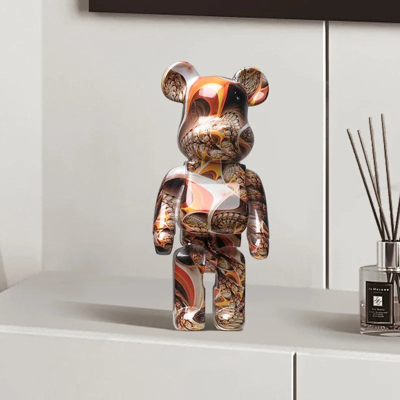Bearbrick design bronze et orange exposé sur un meuble blanc, figurine moderne décorative au style baroque futuriste