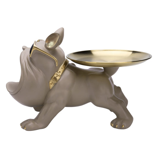 Sculpture chien porte-plateau en résine beige, lunettes dorées et collier stylé — objet déco chic et pratique pour organiser vos petits accessoires avec une touche fun et moderne.