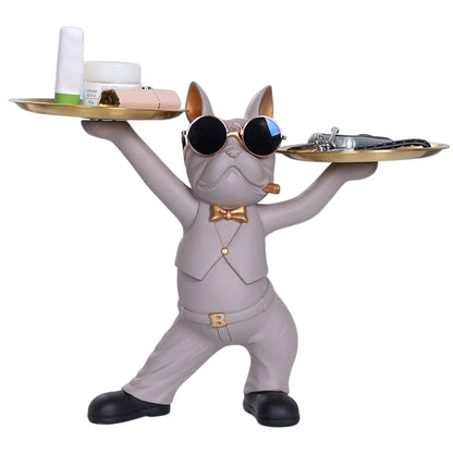 Sculpture décorative de chien majordome beige avec lunettes et plateaux dorés — un accessoire original et pratique pour sublimer une entrée, une console ou un salon moderne