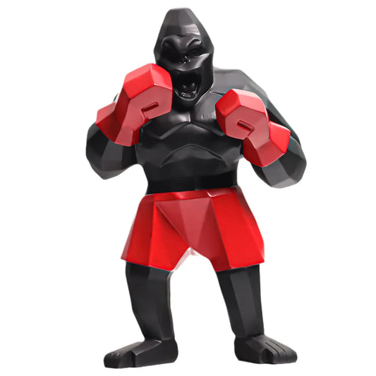 Sculpture gorille boxeur en résine noire avec gants rouges et short rouge, déco pop art audacieuse pour intérieur moderne ou collection geek